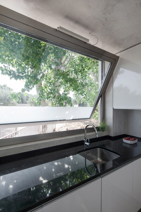 House on a Warehouse by Miguel Marcelino