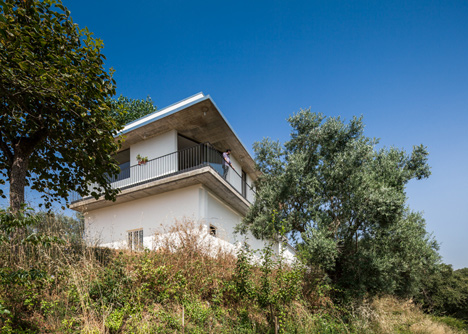 House on a Warehouse by Miguel Marcelino
