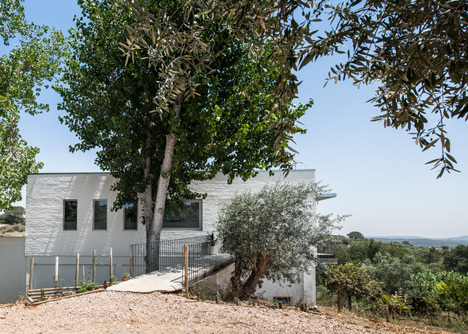 House on a Warehouse by Miguel Marcelino