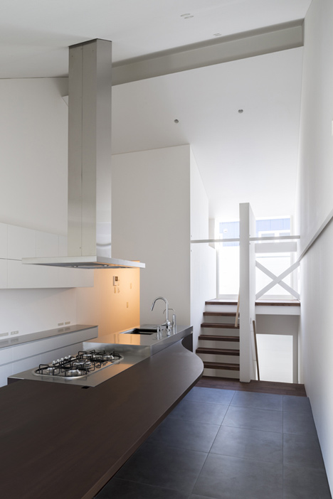 Japanese house designed around a dining table by Tsubasa Iwahashi Architects