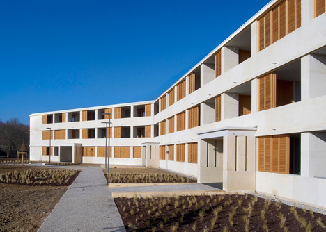 Social housing with solid stone walls by Perraudin Architecture