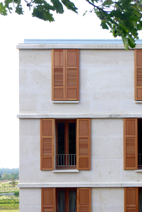Social housing with solid stone walls by Perraudin Architecture