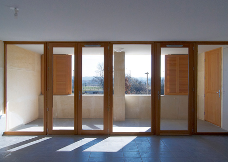 Social housing with solid stone walls by Perraudin Architecture