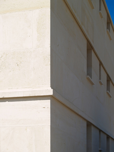 Social housing with solid stone walls by Perraudin Architecture