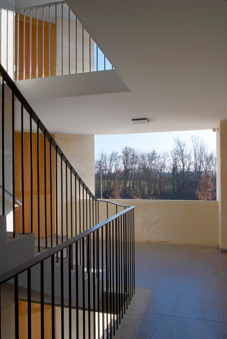Social housing with solid stone walls by Perraudin Architecture