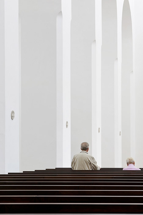 John Pawson's minimal St Moritz Church photographed during a choir rehearsal