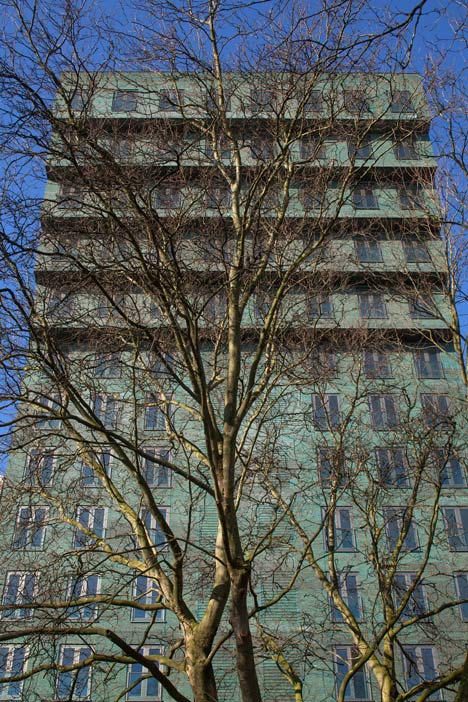 Turquoise tower by NL Architects that staggers back to create sunny balconies