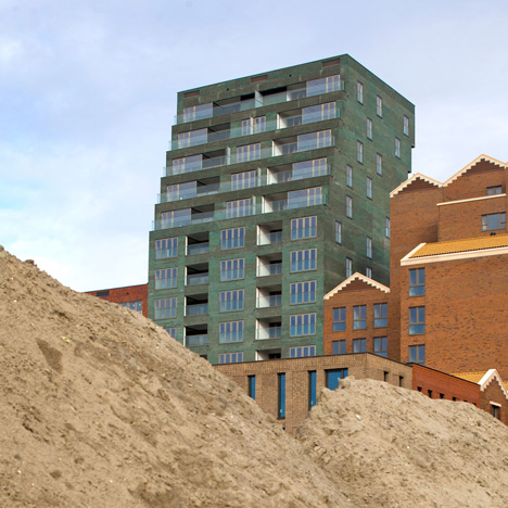 Turquoise tower by NL Architects that staggers back to create sunny balconies