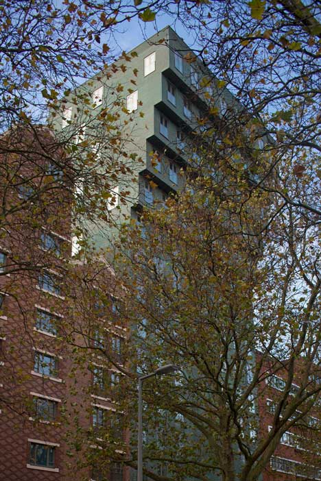 Turquoise tower by NL Architects that staggers back to create sunny balconies