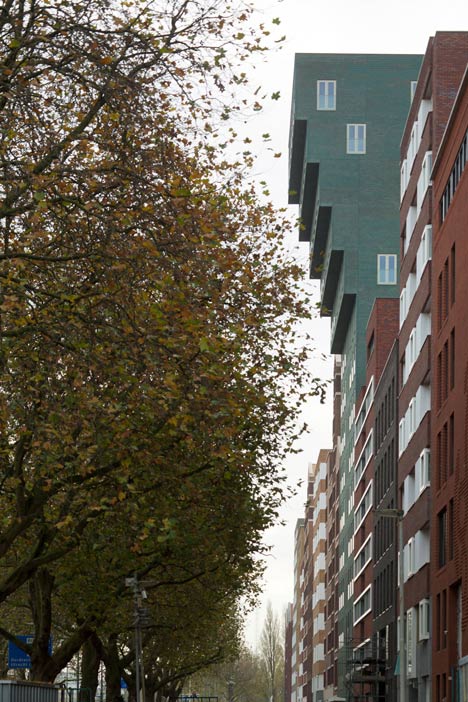 Turquoise tower by NL Architects that staggers back to create sunny balconies