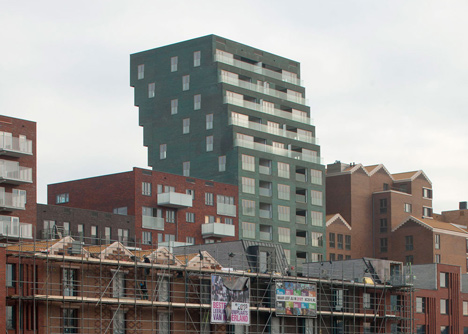 Turquoise tower by NL Architects that staggers back to create sunny balconies
