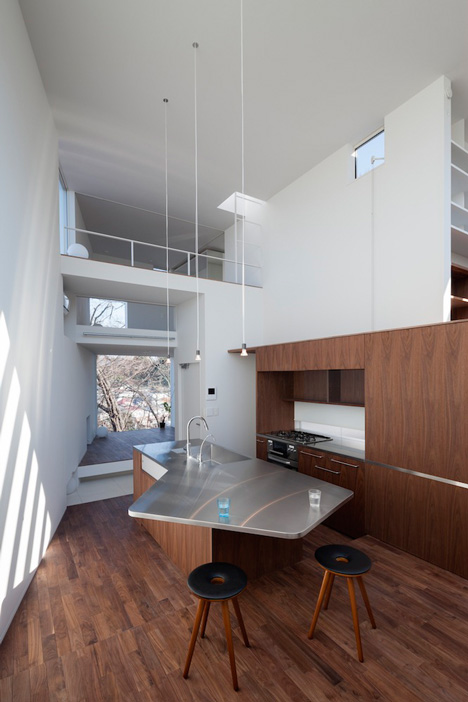 House by Kazuhiko Kishimoto with a public seating deck and gallery underneath