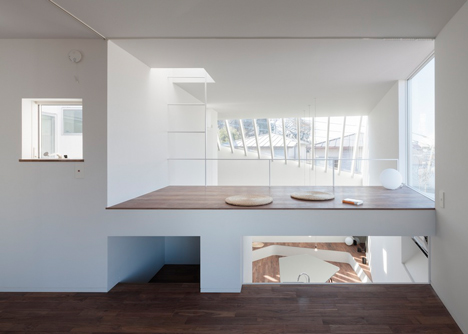 House by Kazuhiko Kishimoto with a public seating deck and gallery underneath