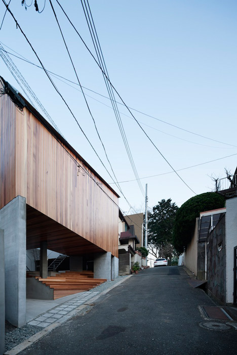 House by Kazuhiko Kishimoto with a public seating deck and gallery underneath