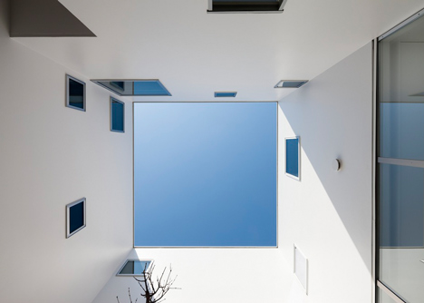 House by Kazuhiko Kishimoto with a public seating deck and gallery underneath