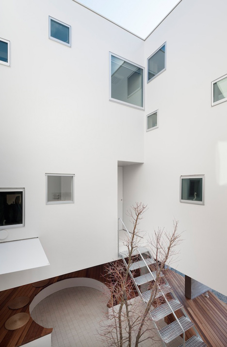 House by Kazuhiko Kishimoto with a public seating deck and gallery underneath