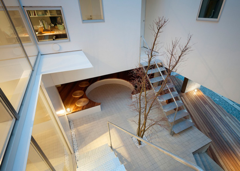 House by Kazuhiko Kishimoto with a public seating deck and gallery underneath