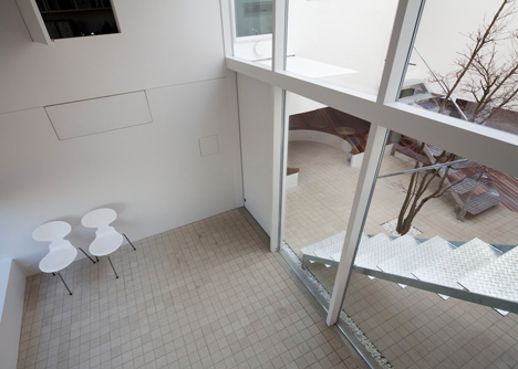 House by Kazuhiko Kishimoto with a public seating deck and gallery underneath