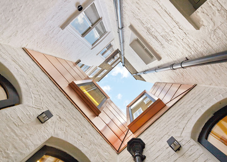 Great James Street Office extension with a faceted copper roof by Emrys Architects