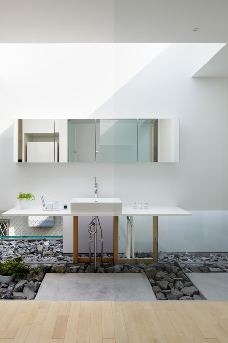 Green Edge House by mA-style Architects encases a perimeter garden behind its walls 
