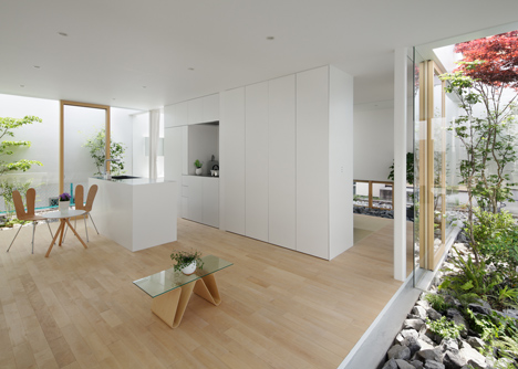 Green Edge House by mA-style Architects encases a perimeter garden behind its walls 