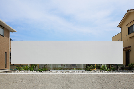 Green Edge House by mA-style Architects encases a perimeter garden behind its walls 