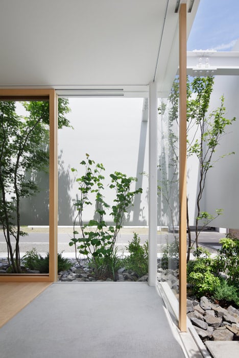 Green Edge House by mA-style Architects encases a perimeter garden behind its walls 
