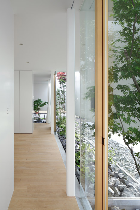 Green Edge House by mA-style Architects encases a perimeter garden behind its walls 