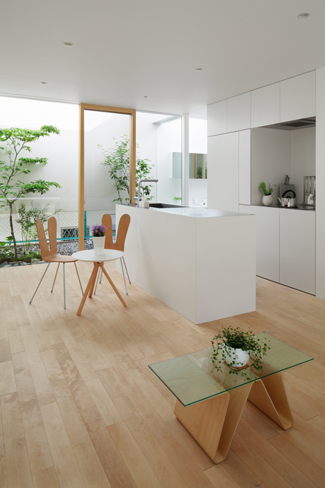 Green Edge House by mA-style Architects encases a perimeter garden behind its walls 