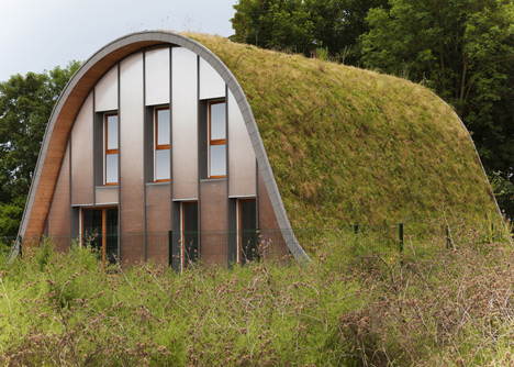 Hump-shaped house blanketed by plants by Patrick Nadeau
