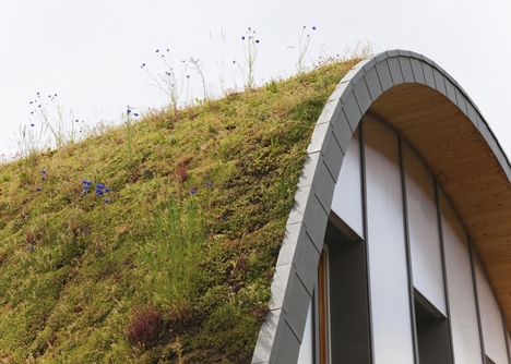 Hump-shaped house blanketed by plants by Patrick Nadeau