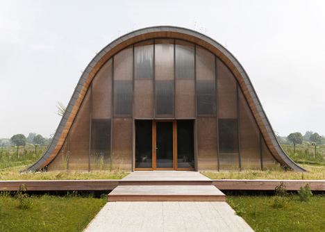 Hump-shaped house blanketed by plants by Patrick Nadeau