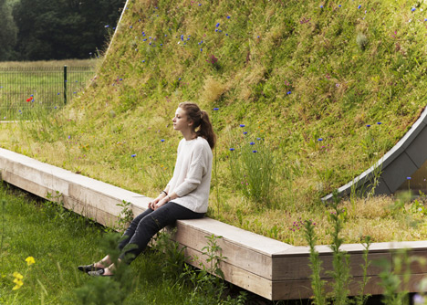 Hump-shaped house blanketed by plants by Patrick Nadeau