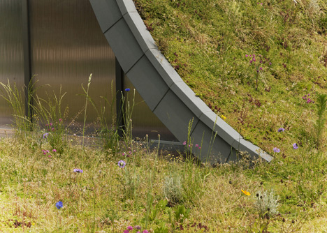 Hump-shaped house blanketed by plants by Patrick Nadeau