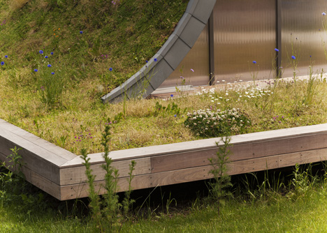 Hump-shaped house blanketed by plants by Patrick Nadeau