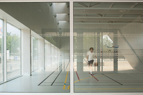 Parisian sports hall by Ateliers O-S Architectes with bands of light on its walls