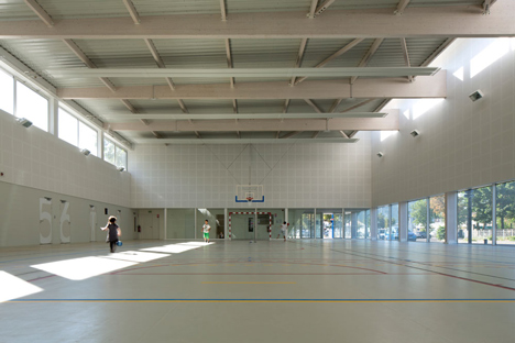 Parisian sports hall by Ateliers O-S Architectes with bands of light on its walls