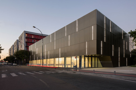 Parisian sports hall by Ateliers O-S Architectes with bands of light on its walls