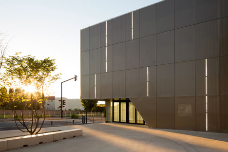 Parisian sports hall by Ateliers O-S Architectes with bands of light on its walls