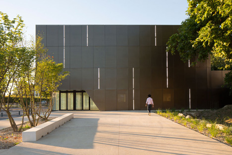 Parisian sports hall by Ateliers O-S Architectes with bands of light on its walls
