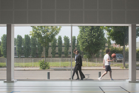 Parisian sports hall by Ateliers O-S Architectes with bands of light on its walls