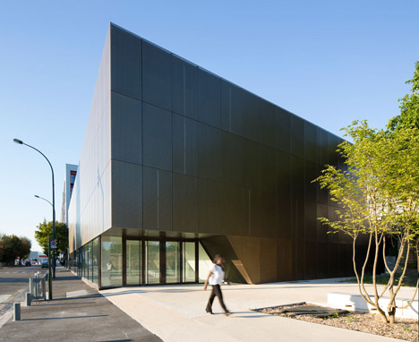 Parisian sports hall by Ateliers O-S Architectes with bands of light on its walls