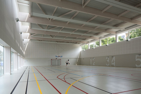 Parisian sports hall by Ateliers O-S Architectes with bands of light on its walls
