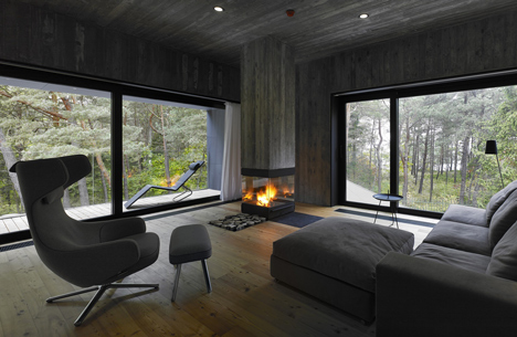 Timber-clad seaside house with a grainy concrete interior by Ultra Architects