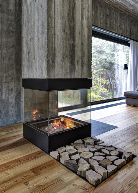 Timber-clad seaside house with a grainy concrete interior by Ultra Architects