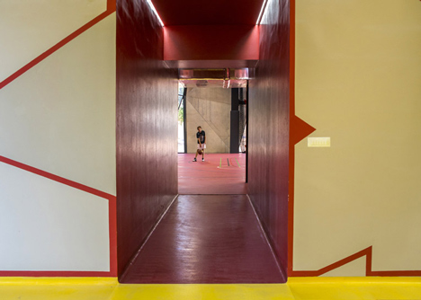 Concrete-clad sports hall by Idis Turato with both faceted and bumpy facades