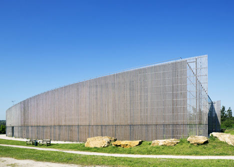 Sports centre clad with sun-bleached wooden slats by Explorations Architecture