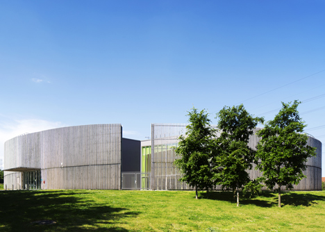 Sports centre clad with sun-bleached wooden slats by Explorations Architecture
