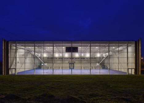 Sports centre clad with sun-bleached wooden slats by Explorations Architecture