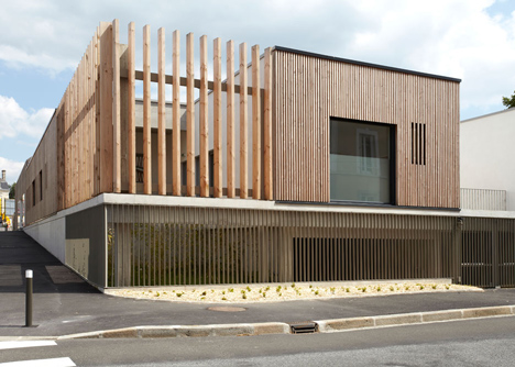 Timber-clad kindergarten in France by Topos Architecture